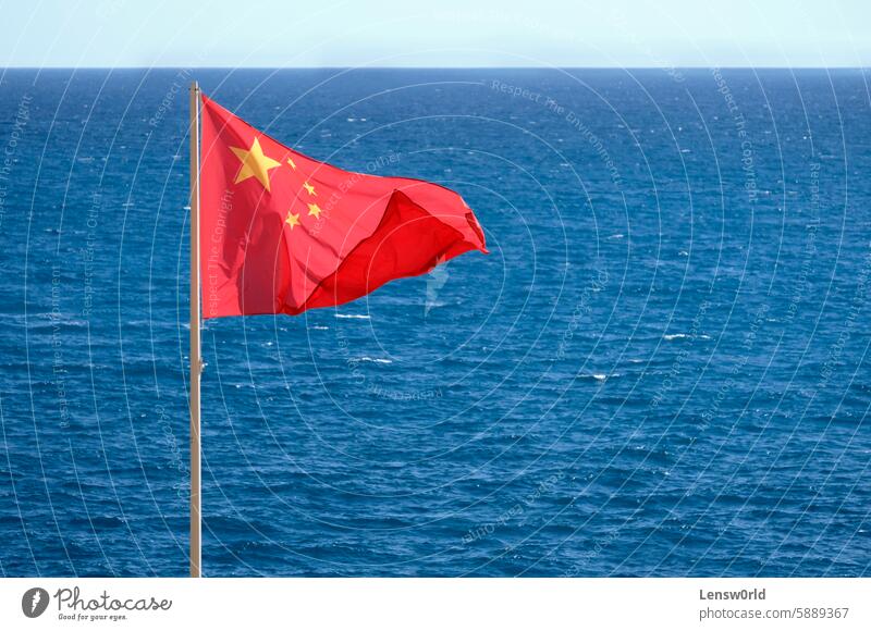 Chinese national flag at the coast near the sea asia banner blue china china national flag chinese chinese flag conflict country flagpole ocean pacific