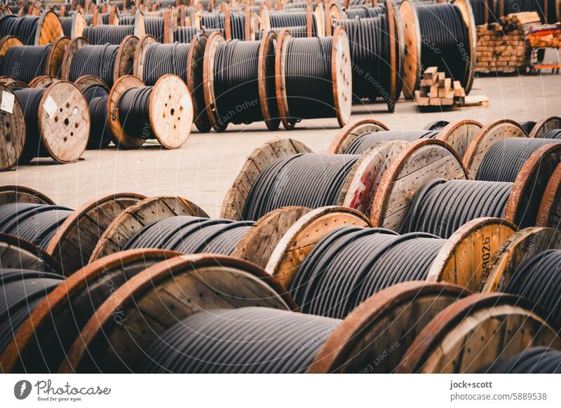 Storage of cable drums Cable drums power cable power line Energy industry storage Wooden spool Wrapped around Preparation Arrangement Collection Authentic Many
