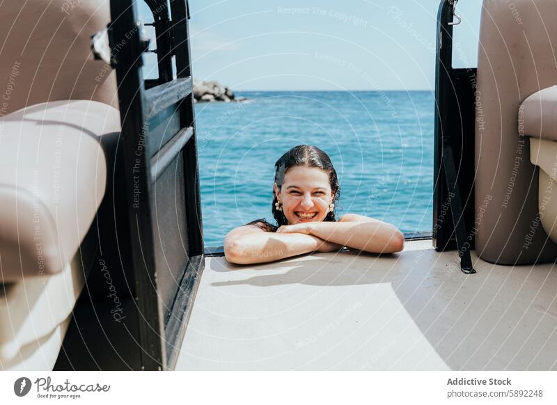 Young woman enjoying summer from a boat holiday sea smile sun water vacation travel leisure happiness cheerful ocean deck coastline sunny youthful female