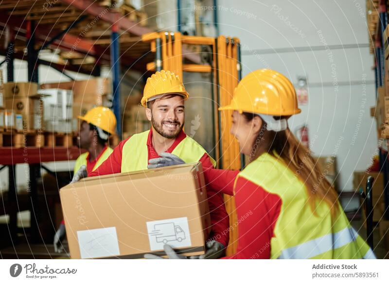 Positive warehouse workers carrying heavy box logistic help together parcel distribute cheerful shipping delivery cardboard coworker multiracial multiethnic