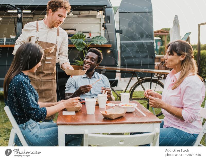 Multiracial friends eating at food truck outdoor during summer vacation - Focus on african man face away bar beverage business buying cafeteria chef city client