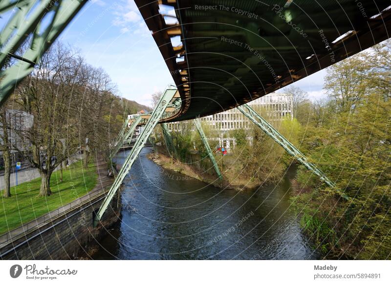 Steel girders of the tracks of the Wuppertal suspension railroad over the river Wupper in the spring sun in the city center of Wuppertal in the Bergisches Land region in North Rhine-Westphalia, Germany