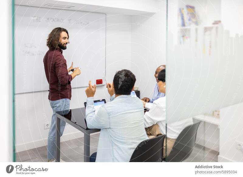 Interactive teaching session in a modern English Academy education english academy instructor student adult whiteboard classroom interaction collaboration