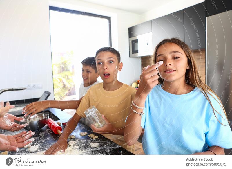 Triplets making a joyful mess while baking in the kitchen triplet cooking playful interaction boy girl siblings flour dough domestic scene casual clothing