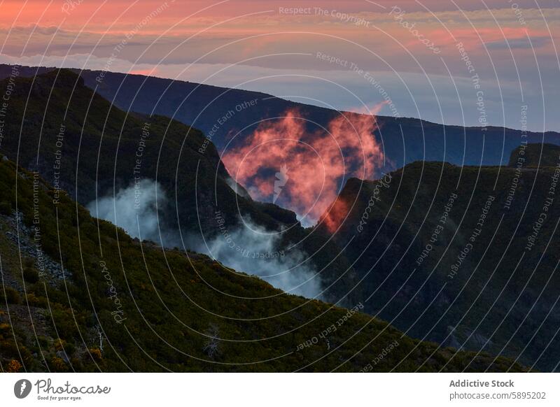 Spectacular clouds at sunset over the rugged mountains of Madeira madeira portugal fog steep landscape nature outdoor travel tourism lush vibrant breathtaking