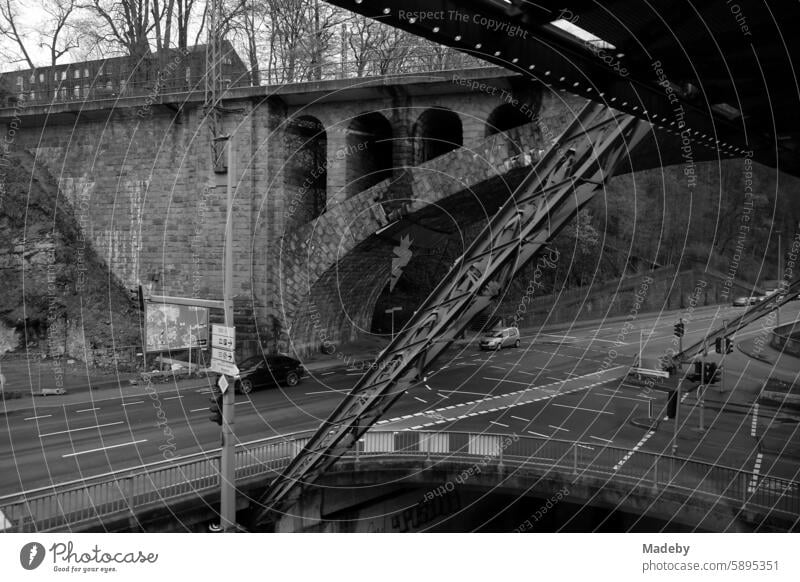 Old bridges for car traffic, railroad and Wuppertal suspension railroad in Wuppertal in the Bergisches Land in North Rhine-Westphalia in neo-realistic black and white