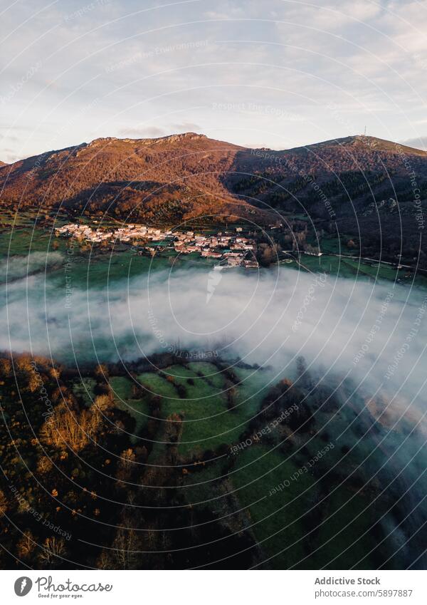 Misty morning over a mountain village in Palencia aerial view fog palencia curavacas espiguete serene peak landscape nature outdoor rural tranquil scenic beauty