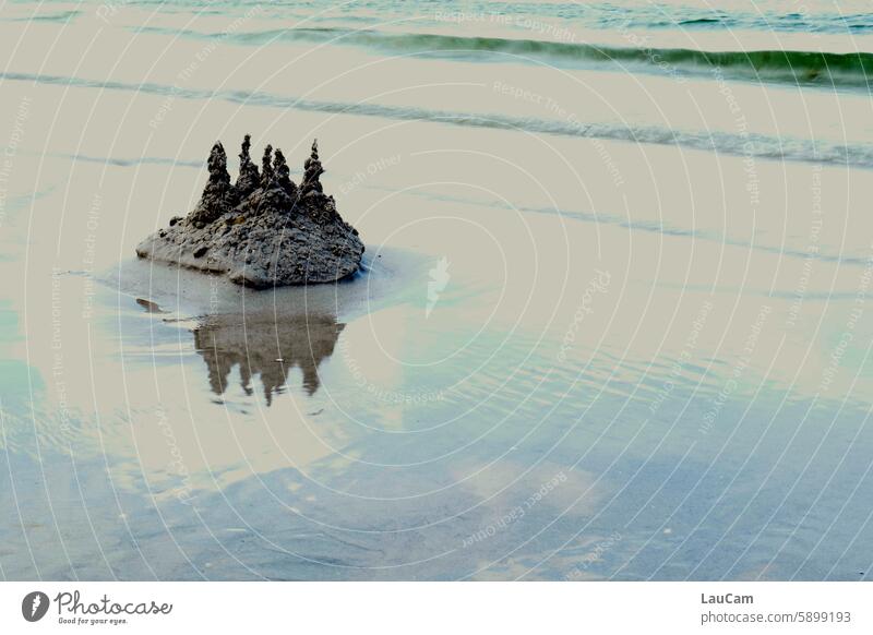 Fortress in danger Sandcastle Ocean Beach Water Waves Lock coast Building a sandcastle Infancy Summer reflection Shaft of light Light Light (Natural Phenomenon)