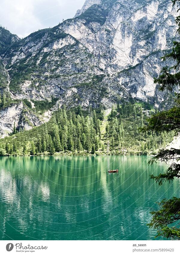 Braies Wild Lake Alps mountains Turquoise Green Waves Mountain Water Landscape Nature Sky Blue Clouds Exterior shot Summer Lakeside Colour photo Environment