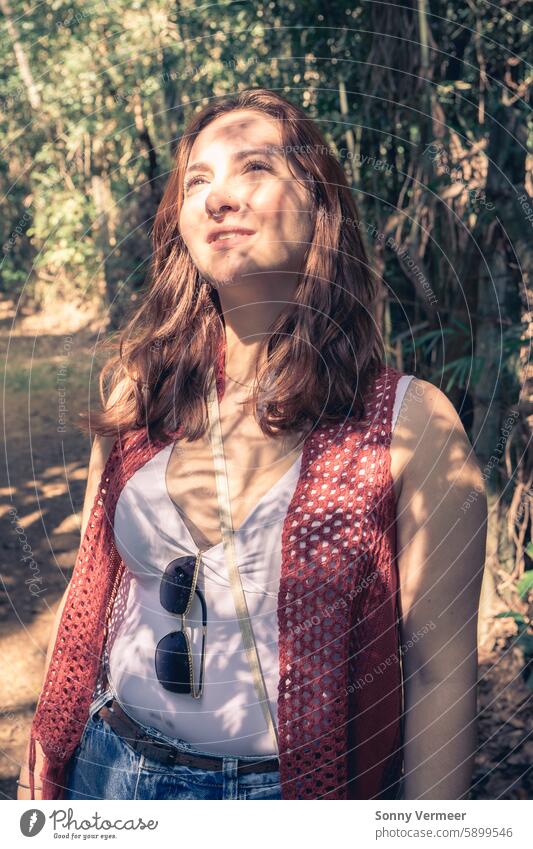 Brazilian woman enjoys the sun when she take a walk in the Botanical garden. Jardim Botanic Garden, São Paulo, Brazil. brazilian hike botanic hardin são paulo