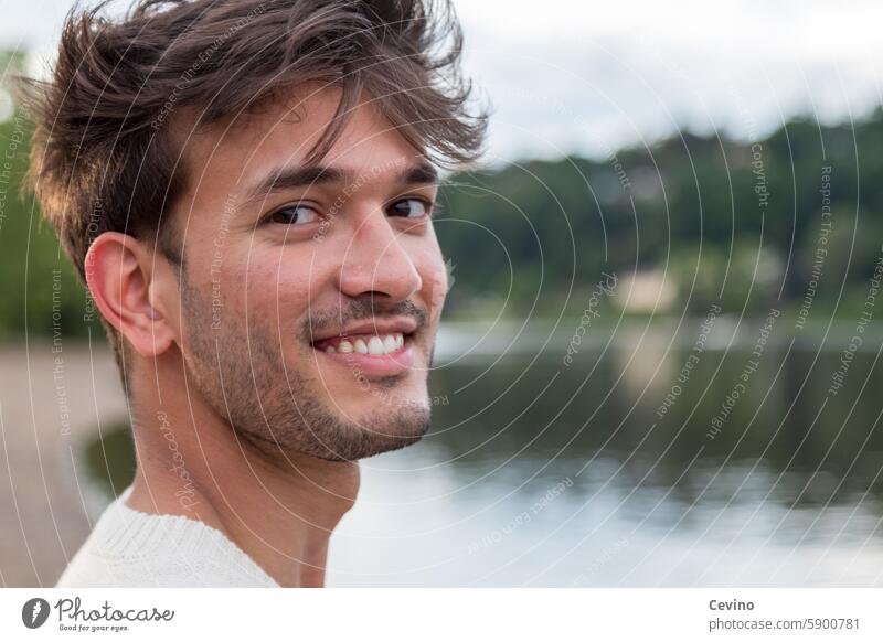 Close-up of a young man from India Man Athletic sexy Muscular kind Congenial Looking into the camera full of relish Exterior shot Nature Green erotic