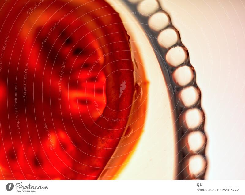 A tomato ...in the light Tomato slice of tomato Slice Vegetable Light X-rayed Red Orange Pattern balls structure lines circles Biological Play of colours hazy