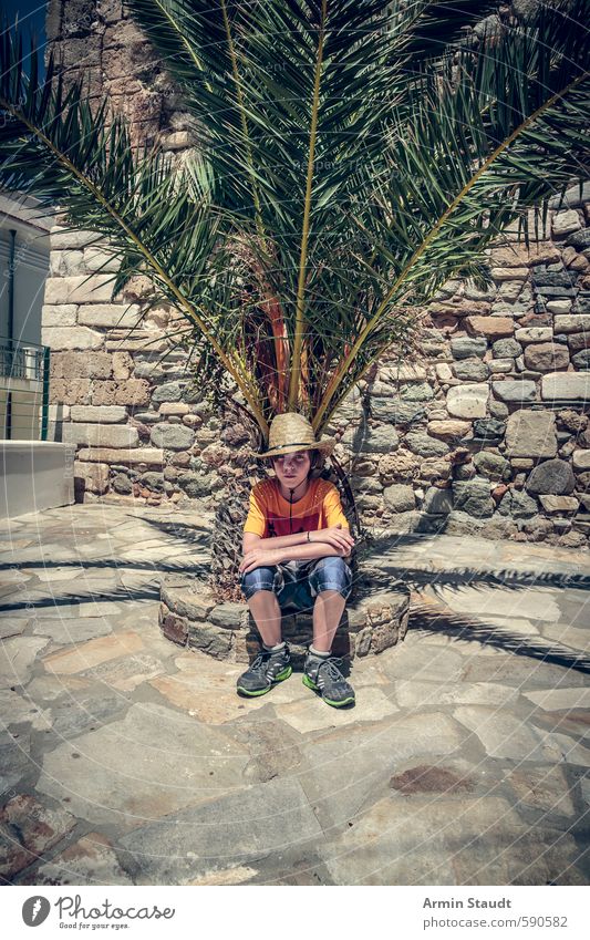 Tired tourist / boy sitting under a palm tree. Lifestyle Vacation & Travel Summer Human being Masculine Youth (Young adults) 1 8 - 13 years Child Infancy Nature