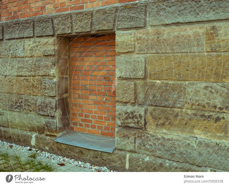 Window bricked up with bricks in a sandstone façade locked Sandstone house wall Closed Barricaded Brick Old Structures and shapes Wall (barrier) Facade Stone