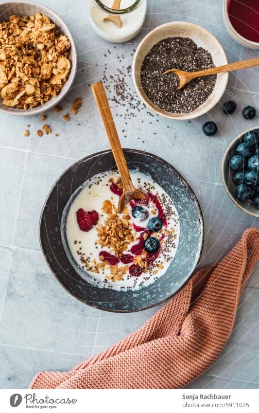 Healthy breakfast with yogurt, berries and chia seeds in a bowl. Ingredients, top view. Breakfast Yoghurt Berries sciatic seed Diet Raw cute Dessert Fruit Spoon