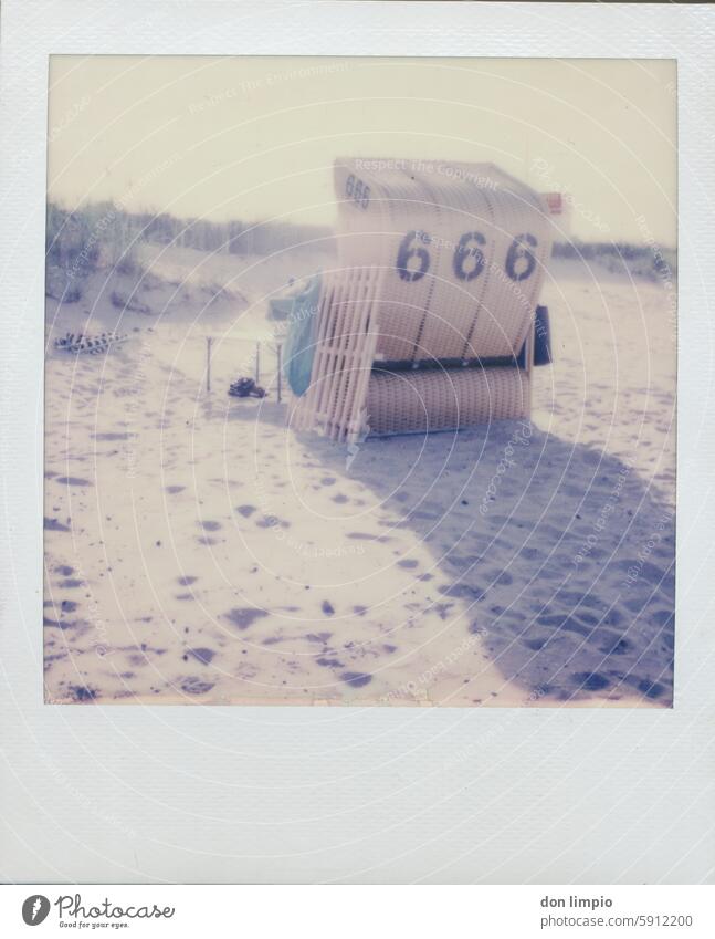 The devil goes on beach vacation Beach Beach dune Beach chair Vacation & Travel Relaxation Summer Deserted Exterior shot Sand Baltic Sea Colour photo