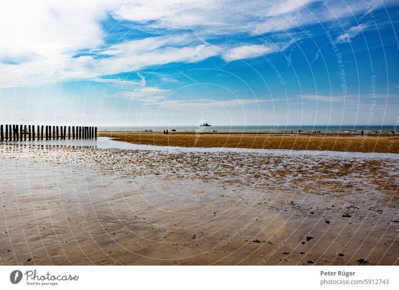 Beach with blue sky and red umbrella sangatte Sky Blue Clouds Vacation & Travel North Sea coast Ocean Landscape Relaxation Sand vacation Tourism destination