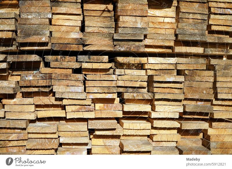 Stacked squared timber in the warehouse of a joinery and carpentry workshop for construction and handicrafts in Adapazari in the province of Sakarya in Turkey