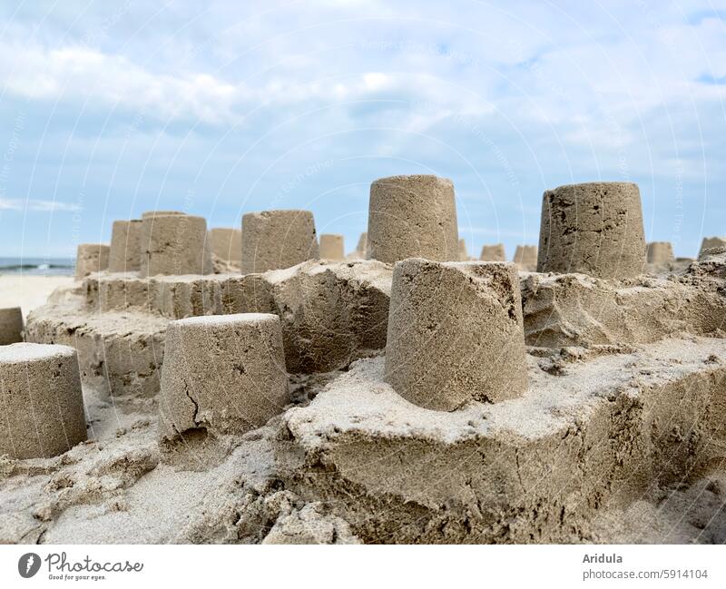 Sandburg on the beach castle Sandcastle Beach Child Playing Build Bucket vacation Vacation & Travel Ocean Summer Infancy Summer vacation coast Sandy beach