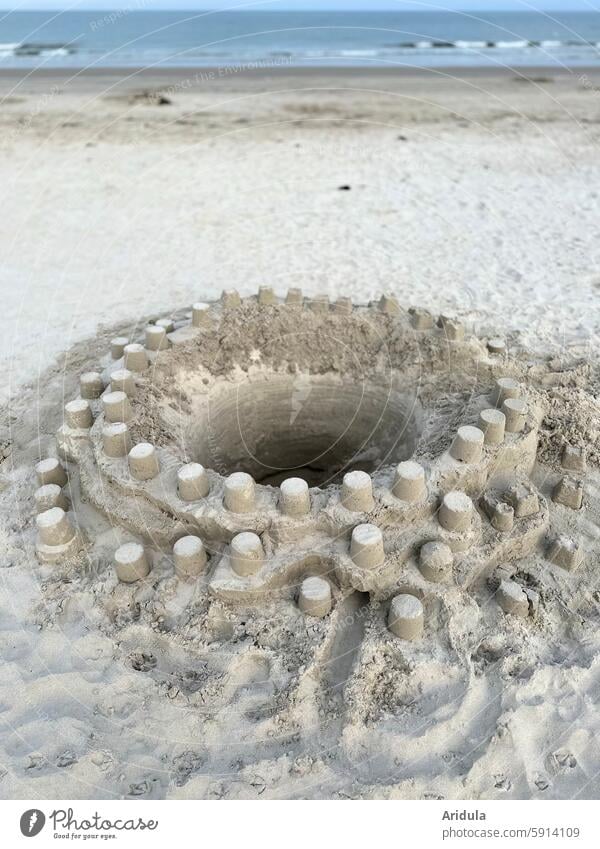 Round sandcastle on the North Sea beach Sand Sandcastle Beach Child Playing Build Bucket vacation Ocean Summer Infancy Summer vacation coast Sandy beach