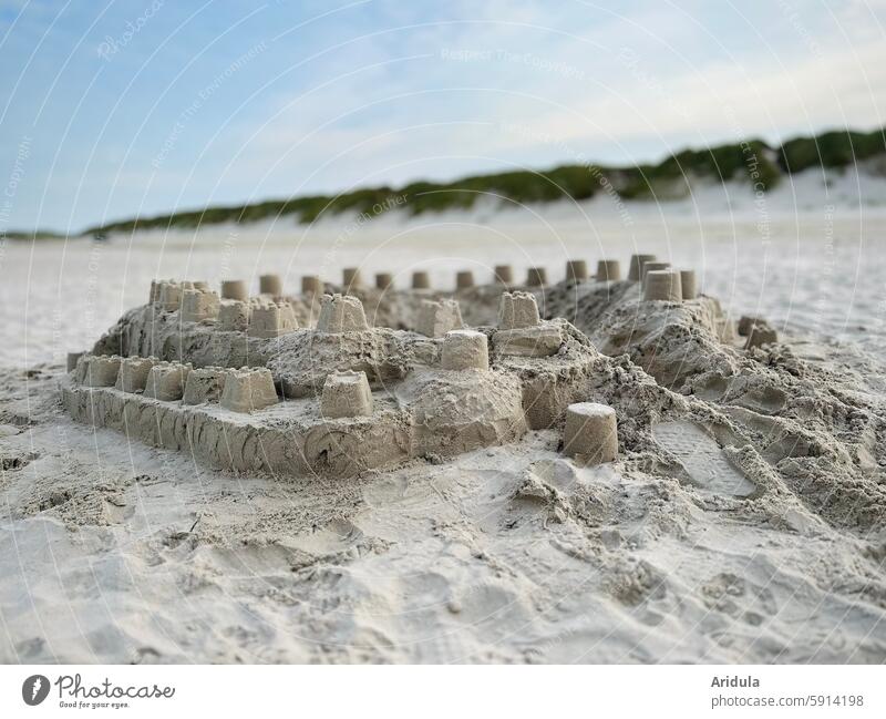 Sandcastle on the beach with dune Beach Child Playing Build Bucket vacation Vacation & Travel Ocean Summer Infancy Summer vacation coast Sandy beach holidays