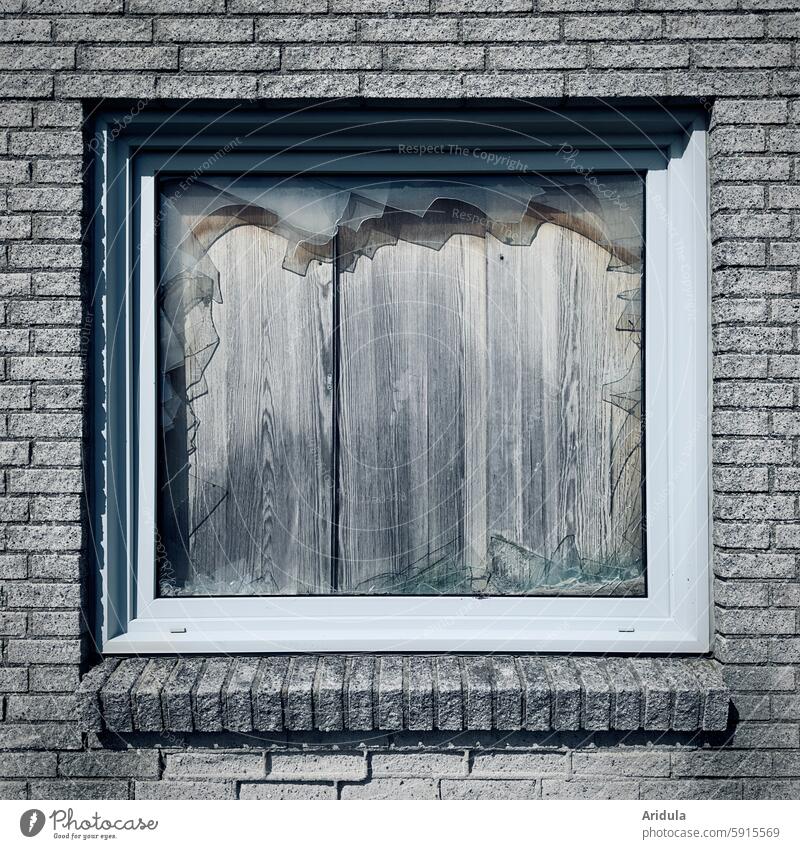 Destroyed window pane | Window boarded up with wooden planks Broken Window pane Smashed window Glass Destruction Vandalism Damage Pane shattered Shard Force