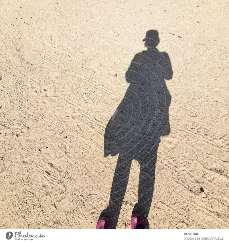 Shadow of a woman on the beach Woman vacation Sand Beach Desert Cap Vacation & Travel Colour photo Tourism coast Light Summer vacation Beautiful weather