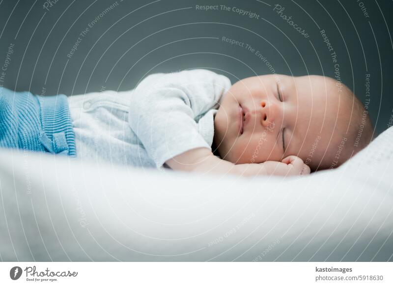 Close-up portrait of adorable baby boy sleeping in bed, 1 year old baby concept child childhood cute lying care beautiful caucasian peaceful toddler little