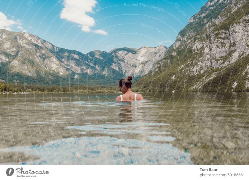 Brunette woman bathing in mountain lake in front of mountain panorama Woman bathe Swimming & Bathing Water Relaxation Vacation & Travel Summer Refreshment