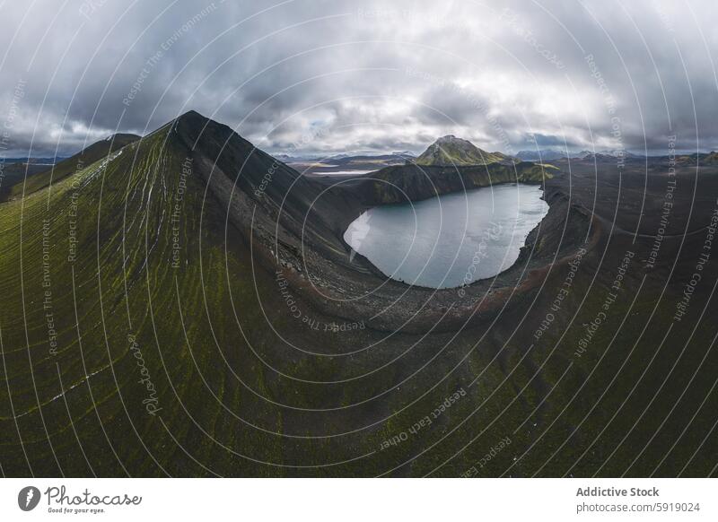 Aerial view of dramatic black and green mountains in Iceland iceland highland lake aerial overcast landscape nature volcanic scenery serenity panorama elevation