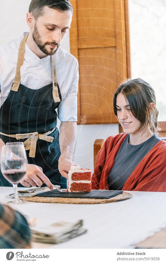 Private chef serving cake to a woman at a dining table private looking down red velvet dessert wine glass interest elegant dining room contemporary ambiance