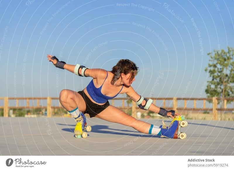 Young woman skateboarding in outdoor park young trick skate park city skill focus active fitness hobby action motion dynamic energy balance exercise