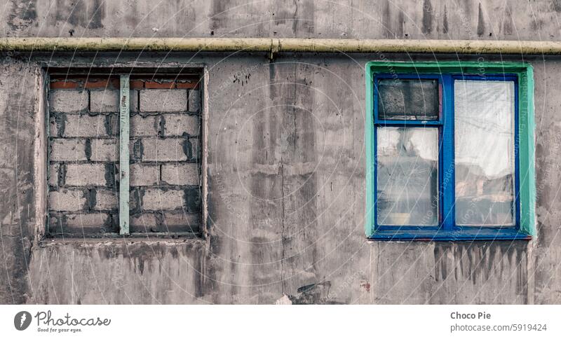 brick closed window of an old building Ukraine abandoned architecture backdrop background block blue buried city color conflict covid exterior frame glass