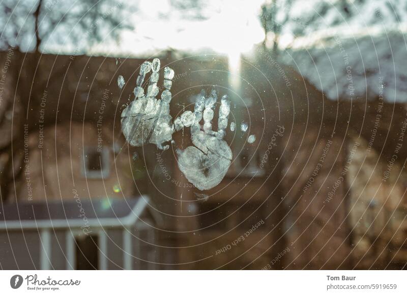 Prints of children's hands on the window pane against the light Imprint Palms Window pane Back-light House in the background Fat finger Fingers sunshine Autumn