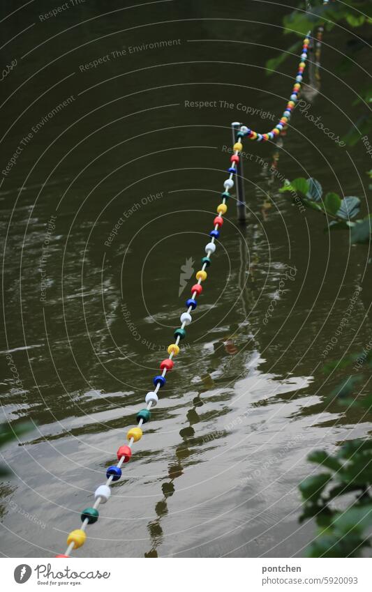 pretty, colorful, barrier chain reflected in the lake. boundary. Lake Chain Shut-off chain variegated colored Water Nature reflection cordon Safety