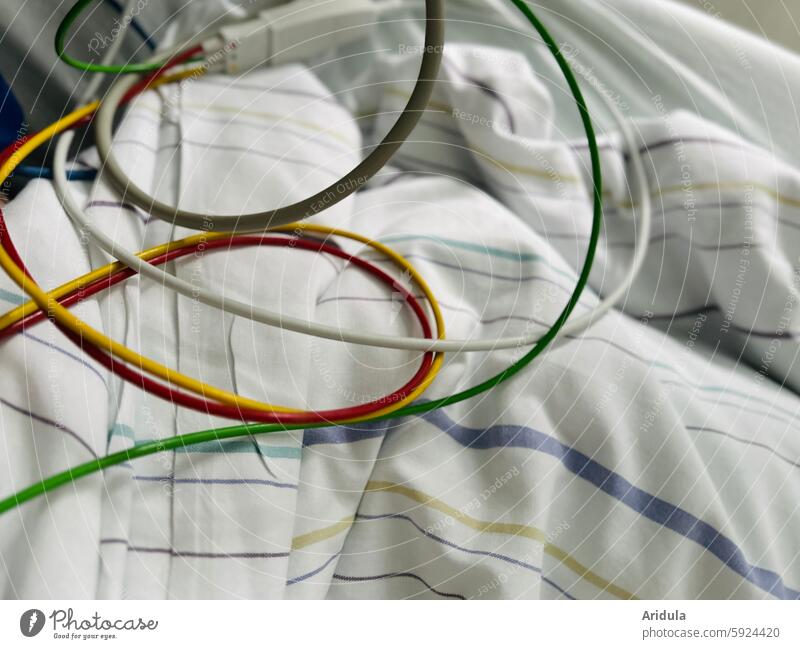 ECG cable on a hospital bedspread Hospital Cable ekg Duvet Bed Health care Measurement Illness Healthy Diagnosis Equipment Medical treatment Heart clinic