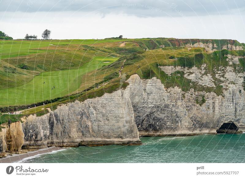 Around Etretat in France normandy france golf course seine-maritime sea ocean coast cliff rock formation beach chalk cliff rock face summer footpath overgrown