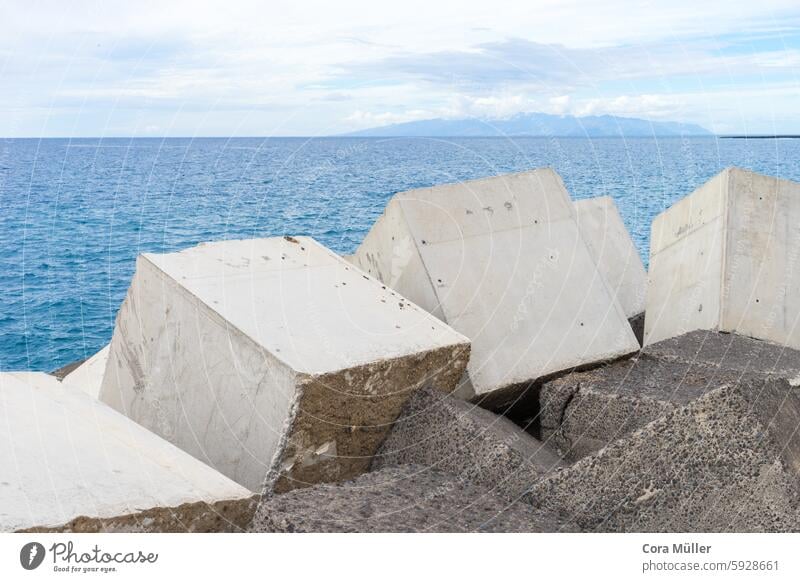 Cube-shaped shore fortification on the Atlantic on Tenerife cube-shaped cubes Island Atlantic Ocean Water Concrete Gray Blue Sky Canaries vacation Protection