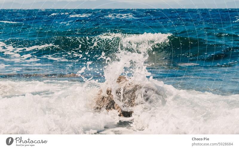 waves and splashes of sea surf and stones on the seashore in Egypt Dahab South Sinai Red Sea blue blue water detailed exotic foam horizon landscape mountains