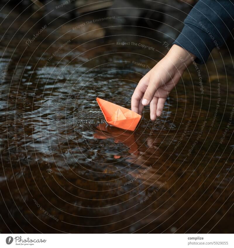 second last Paper boat Target Sailing ship Navigation Beach River bank coast Lakeside Waves Nature Water Environment Child Sun Summer vacation Freedom Tourism