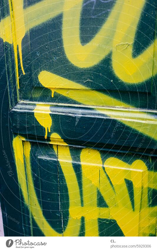 ut / only floating is more beautiful / yellow on green Graffiti Yellow Wooden door Structures and shapes Detail Colour