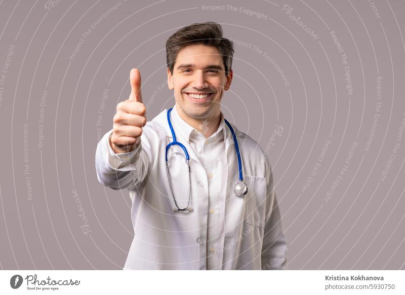 Positive doctor man with like, thumbs-up hand sign gesture. Happy physician good ok okay yes choice agreement satisfaction symbol approve trust approval