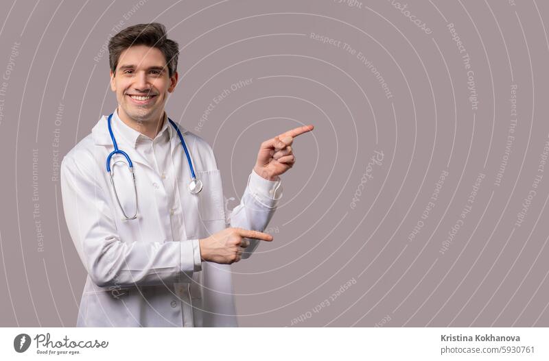 Recommending smiling doctor man pointing right side, copy space or advertising adult advertisement attractive businesswoman direction direction pointing