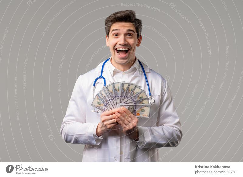 Rich Doctor Man with Usd money. Handsome Medical Health Care Worker In White Coat with salary, payment. Jackpot, win achievement adult african american banking