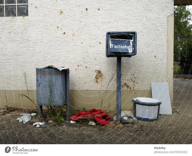 Old mailbox of the student council with trash can and bulky waste on an old building in natural colors of the University Hospital Giessen on the Lahn in Hesse