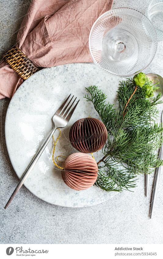 Top view festive Christmas table setting with unique decorations christmas top view marble plate cutlery pink napkin concrete background texture stylish holiday