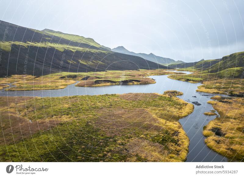 Icelandic Highlands with Meandering Rivers iceland highland mountain river landscape nature greenery volcanic hill mist sky serene meandering water outdoor