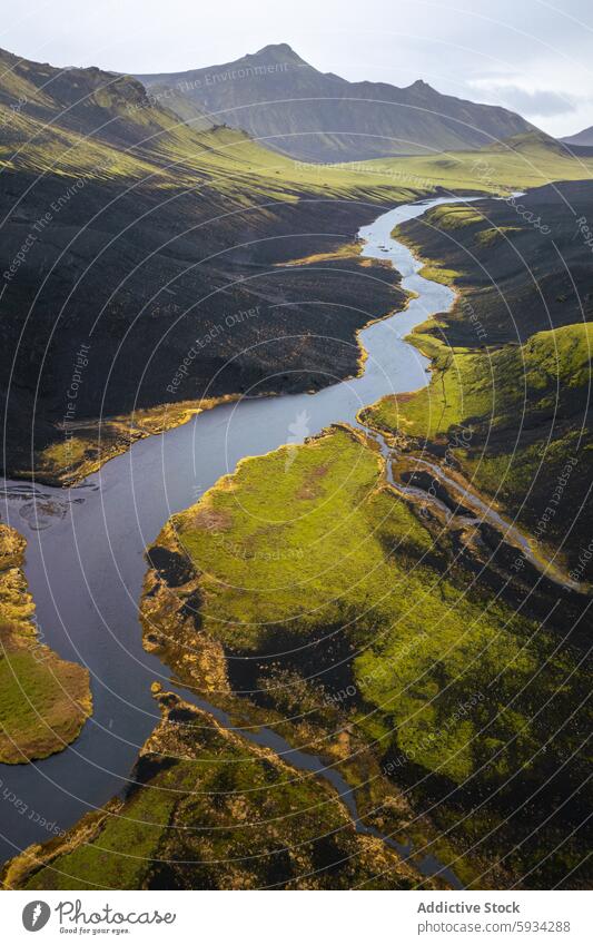 Serene Icelandic Highlands with meandering rivers iceland highland mountain aerial view landscape serenity green nature undulating sky soft light outdoor