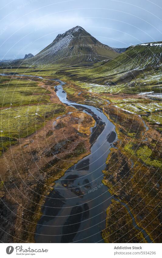 Majestic Mountain and Winding River in Icelandic Highlands iceland highland mountain river serpentine terrain sky moody landscape nature outdoor scenic beauty