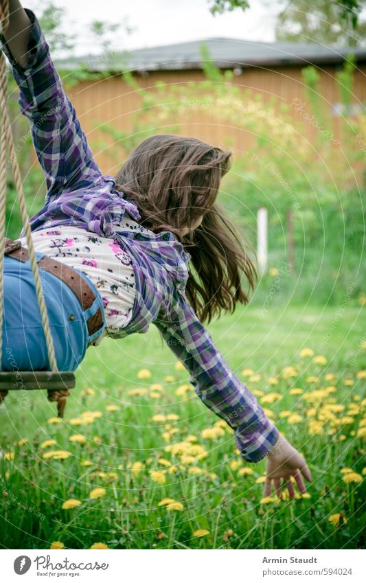 Girl on swing bends back and reaches for flowers Lifestyle Playing Summer Human being Feminine Youth (Young adults) 1 13 - 18 years Child Nature Spring Garden
